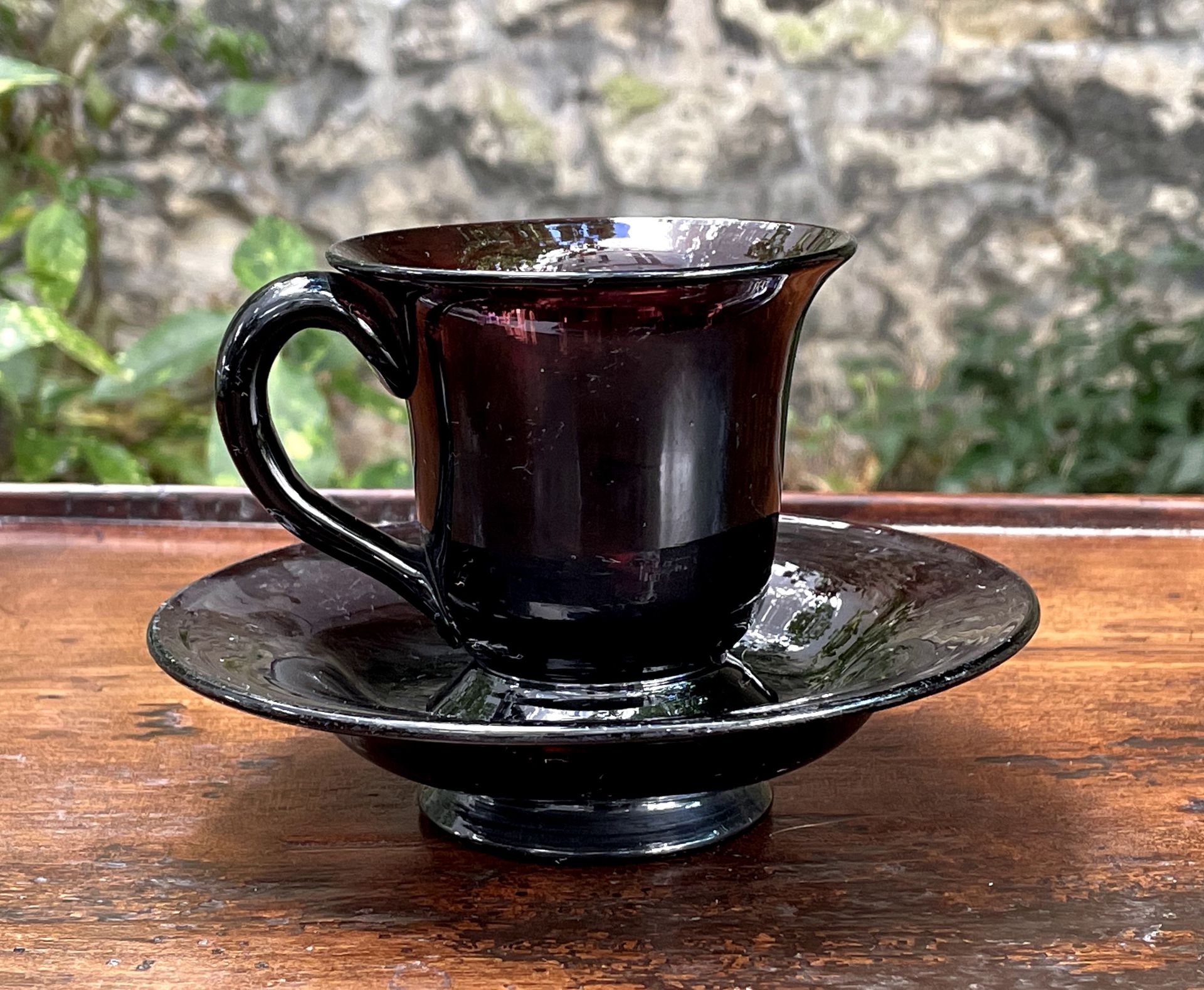Null 
Amethyst glass cup and saucer.



In the style of Peking glassware, 19th c&hellip;