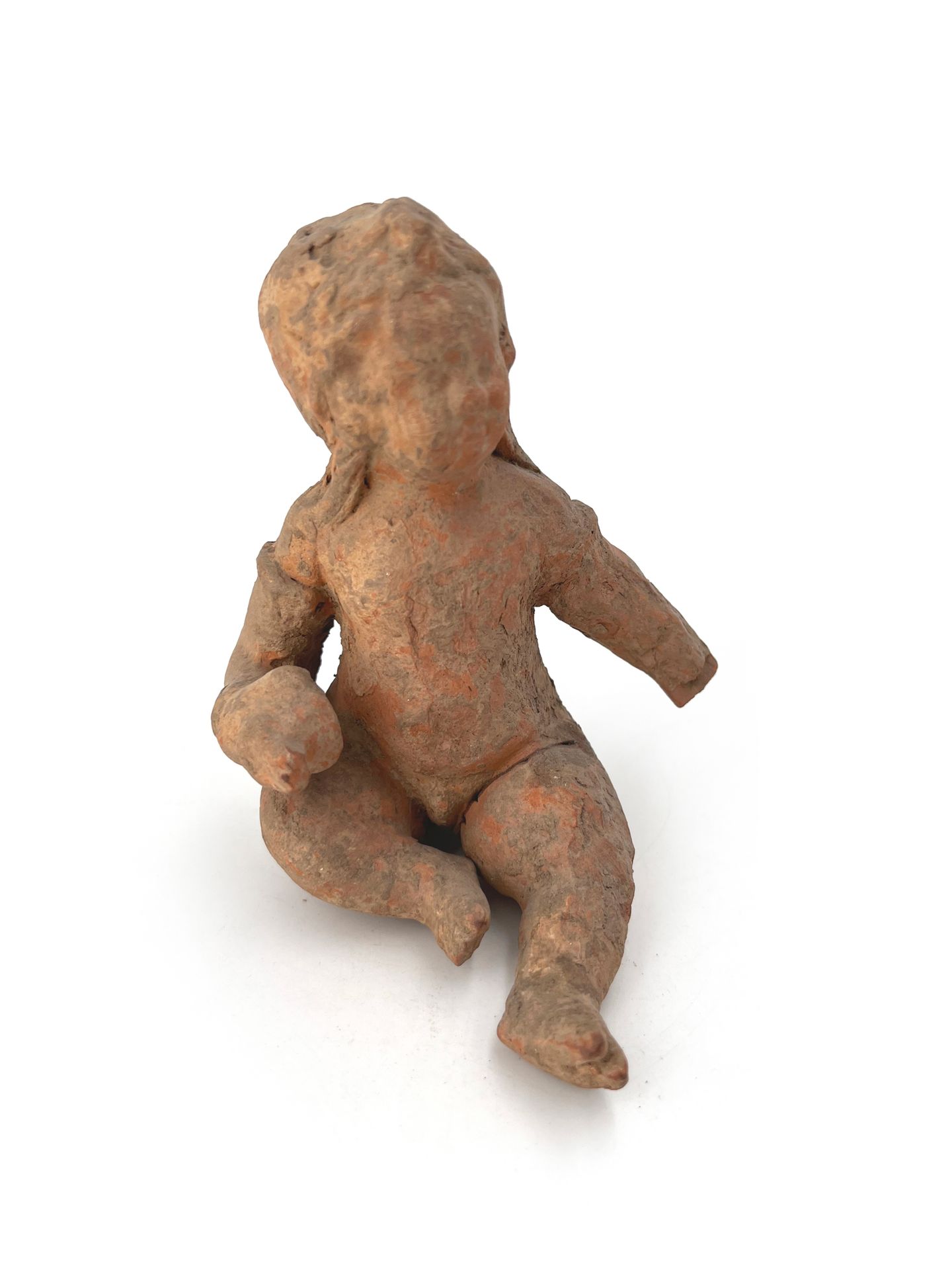 Null Seated child in orange terracotta.
Egypt, Roman period II-IIIth century H :&hellip;