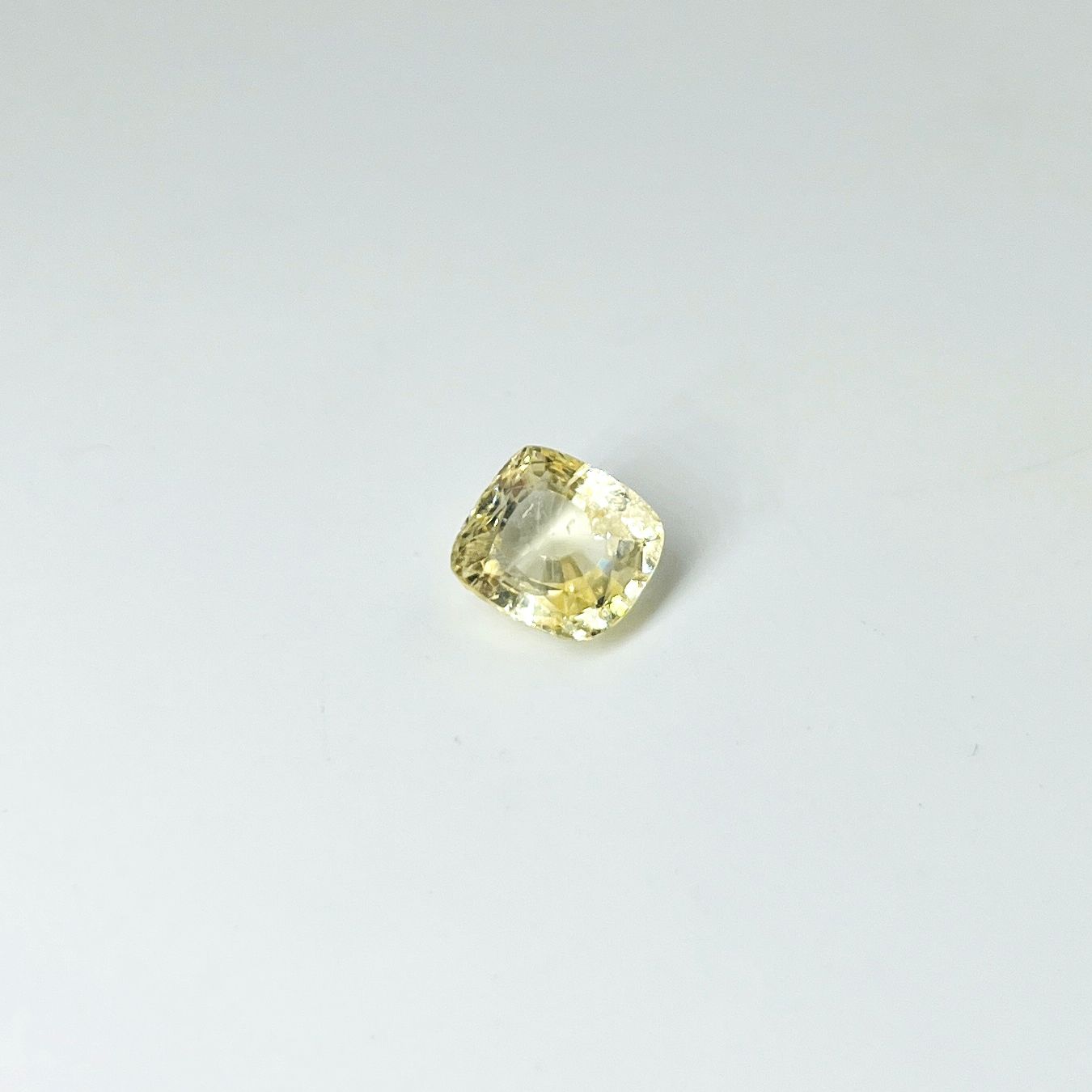 Null Cushion yellow sapphire weighing 4.21 cts. (chips on the table) Accompanied&hellip;