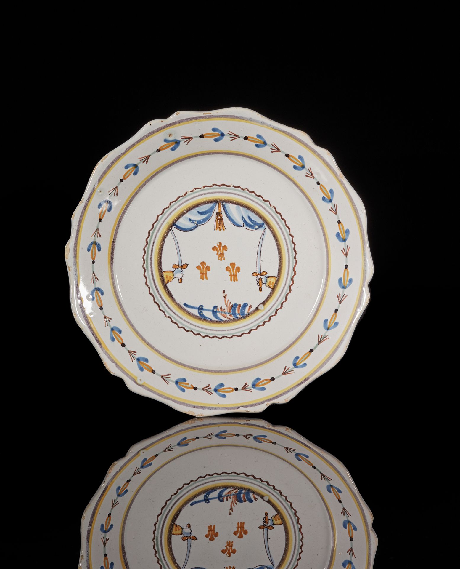 NEVERS An earthenware contourné plate with polychrome counter-revolutionary deco&hellip;