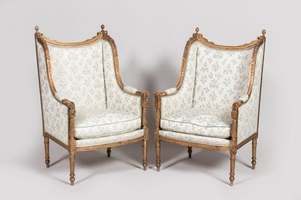 Null Pair of gilded and carved wood bergères with ears. Louis XVI style, Napoleo&hellip;