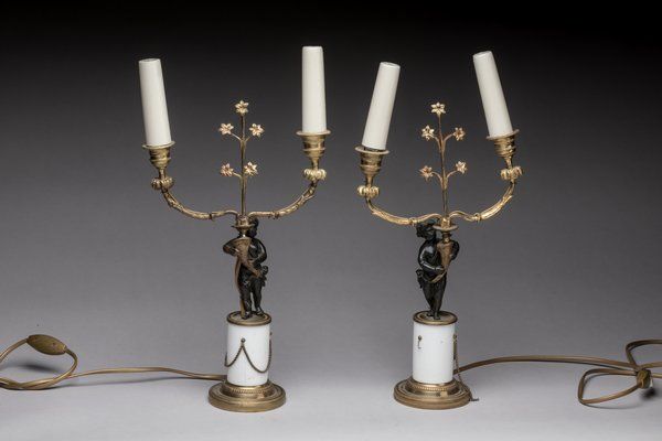 Null Pair of candelabras with 2 arms of lights. The shaft decorated with torchbe&hellip;
