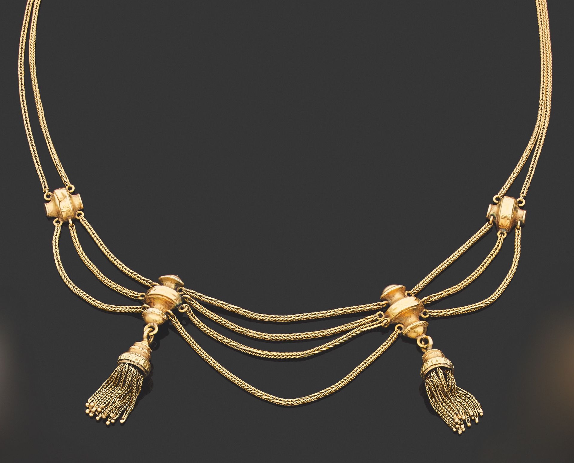 Null DRAPERY NECKLACE. 
750 thousandths yellow gold, adorned with four baluster-&hellip;