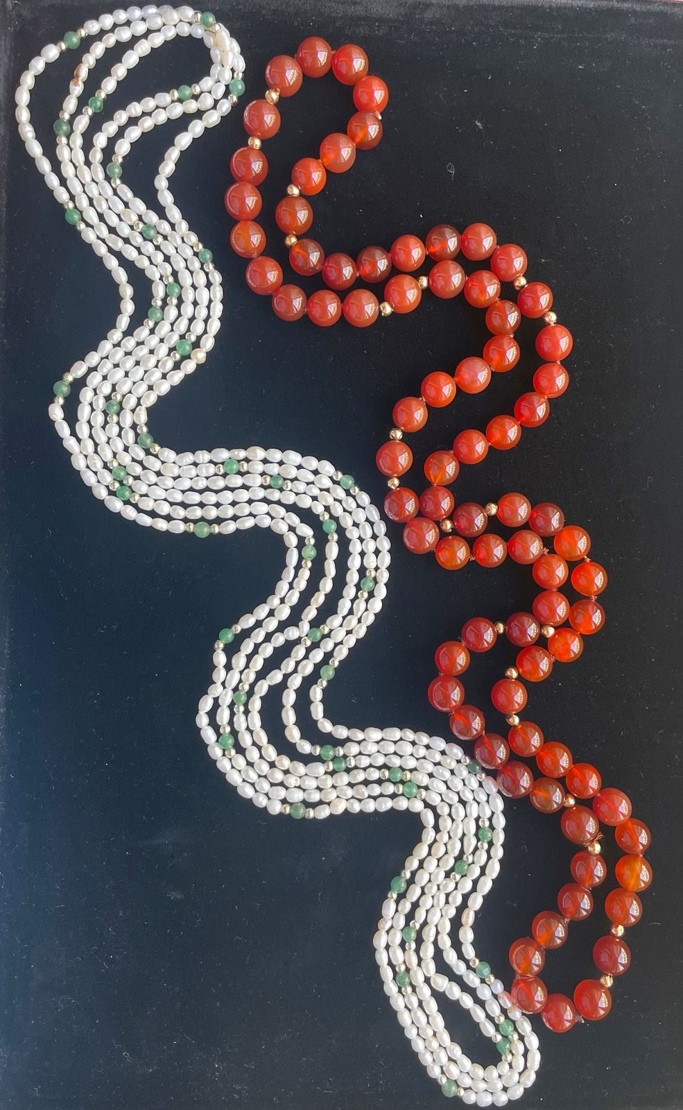 Null TWO NECKLACES. 
One with carnelian balls, the other with freshwater pearls.&hellip;