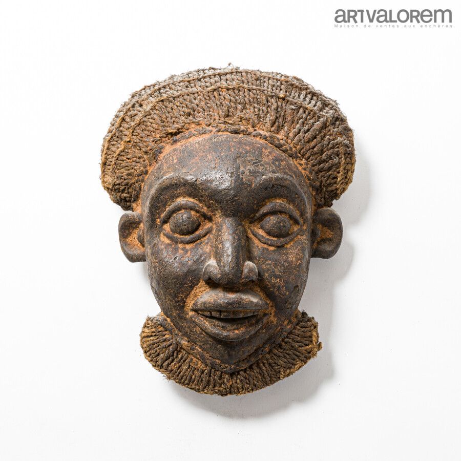 Null BAMILEKE (Cameroon) wooden mask with braided hair from the Kom region.

H. &hellip;
