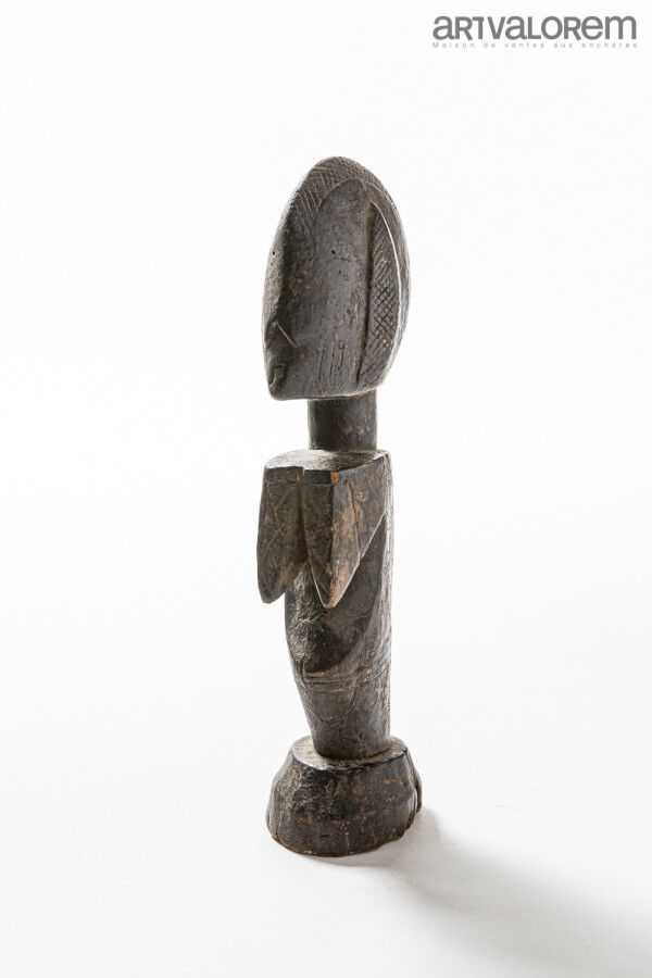Null MOSSI doll (Burkina Faso), female statuette with black crusty patina.

H. 4&hellip;