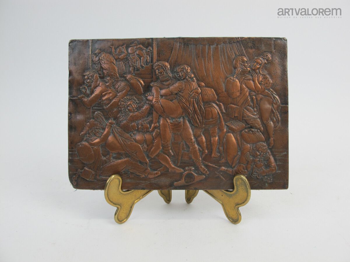 Null Bronze plate with copper patina engraved with a saucy military scene. 

13 &hellip;