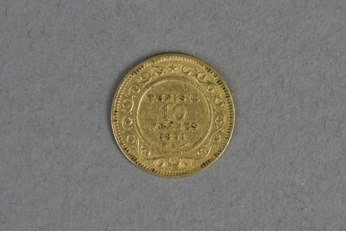 Null TUNISIA

10 francs gold, year 1891