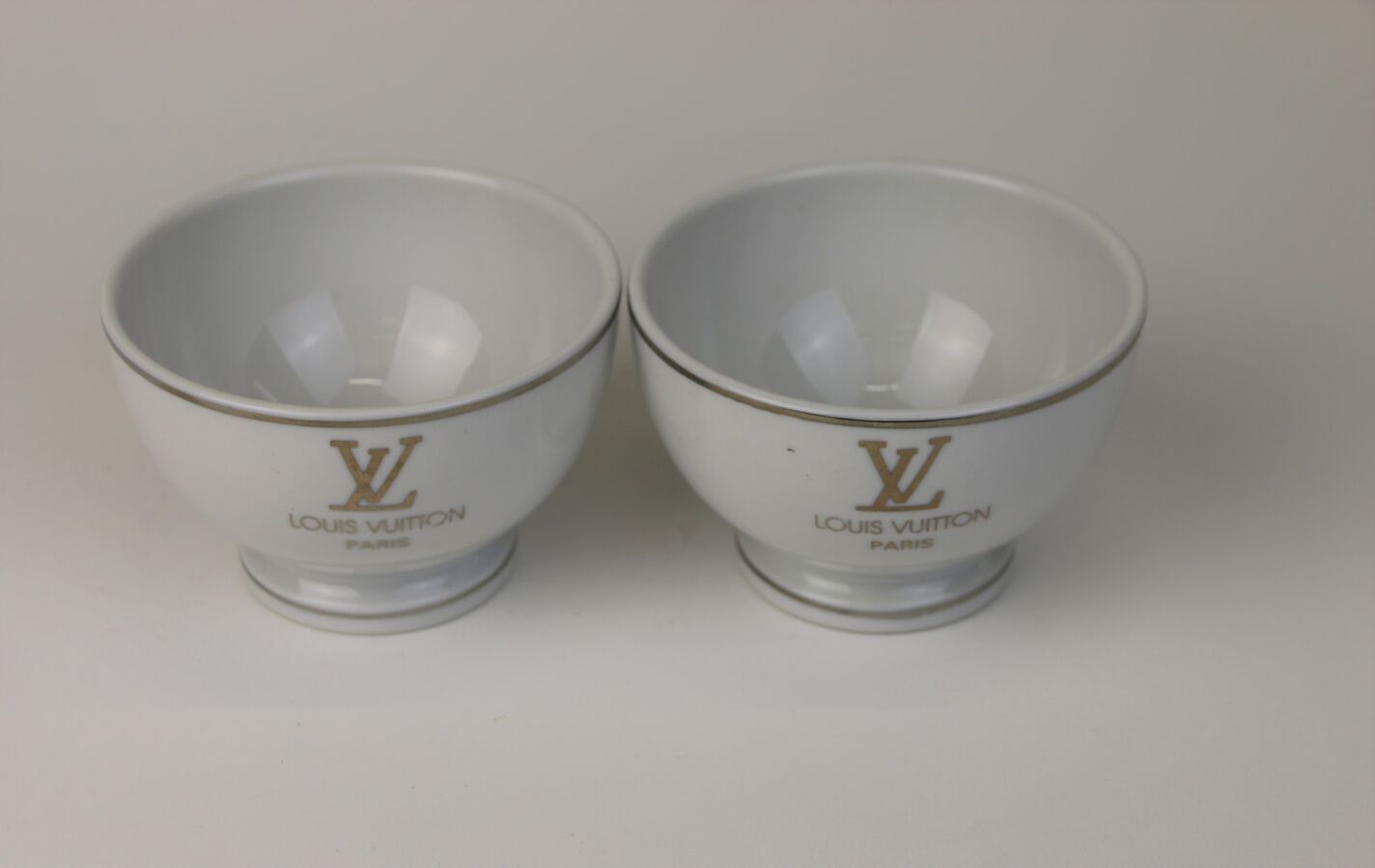 Louis Vuitton (years 2010) Two cups in white enamelled c…