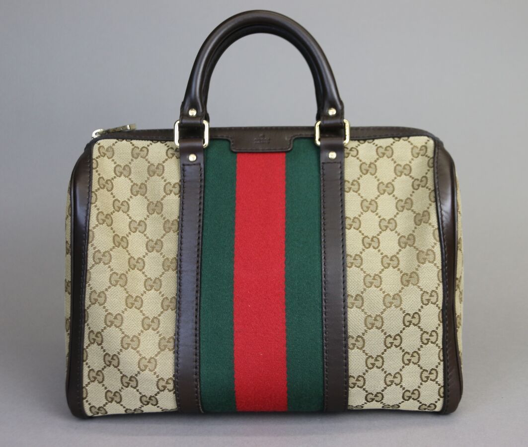 Null GUCCI 
Handbag, monogrammed canvas and brown leather, red and green striped&hellip;