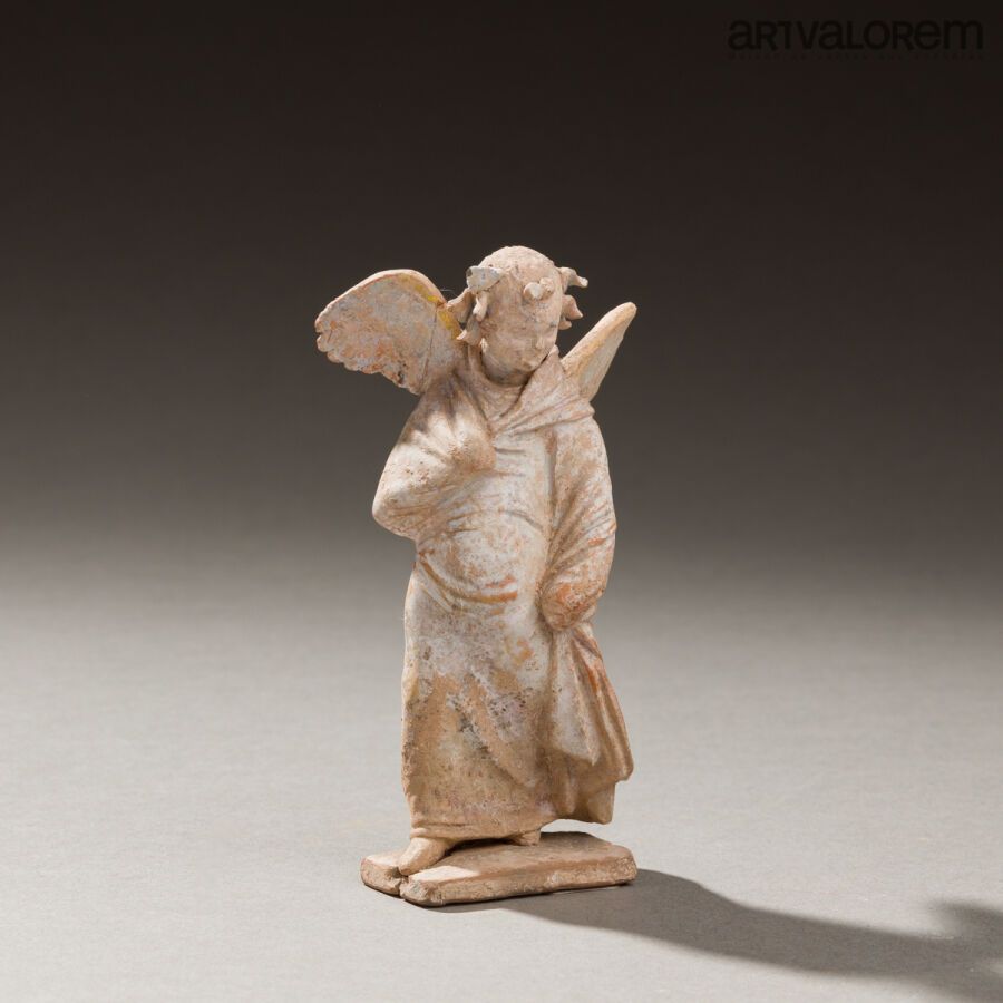 Null Statuette representing a child Eros draped in a himation and wearing a plan&hellip;