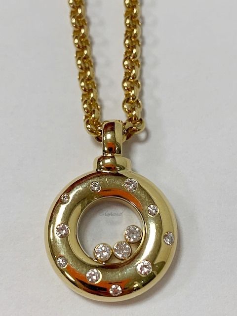 Null CHOPARD. Happy Diamonds pendant in 18K yellow gold set with ten diamonds (i&hellip;