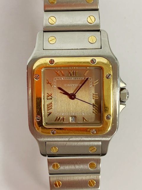 Null 卡地亚。桑托斯曲线型金钢腕表，编号187901-61044。灰褐色的表盘。石英机芯。带箱子和证书。