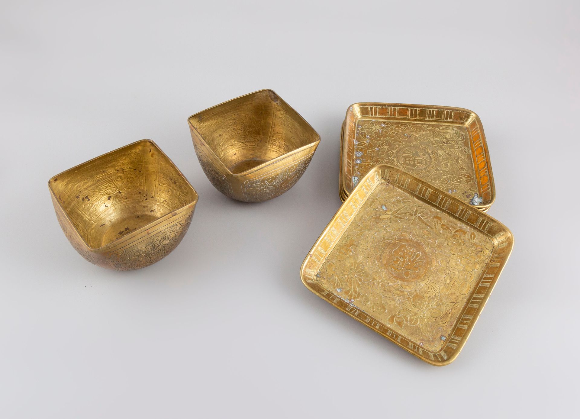 Null Lot including six copper cups with engraved ideograms and two square bowls.