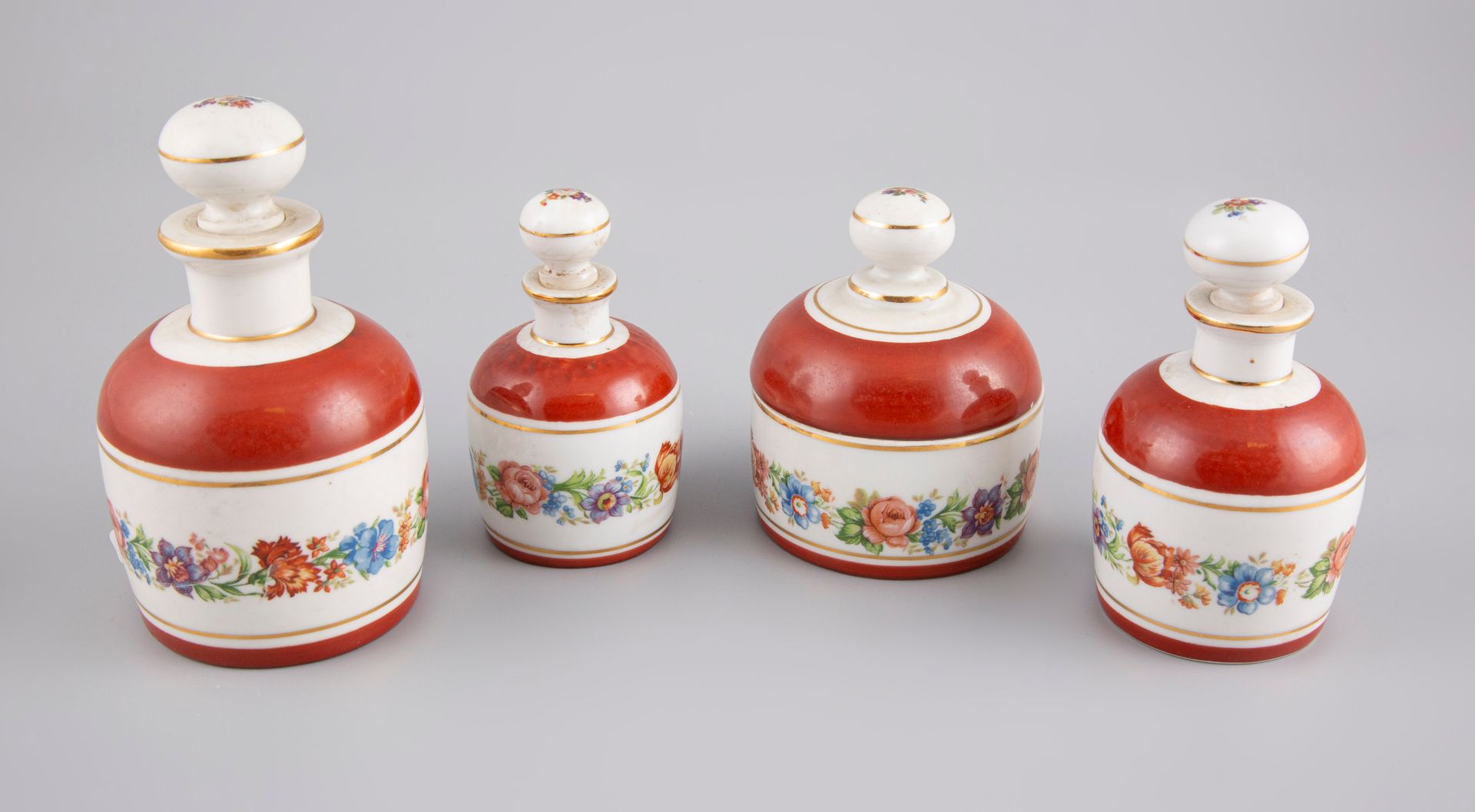 Null Set of 4 porcelain bottles with flowers.