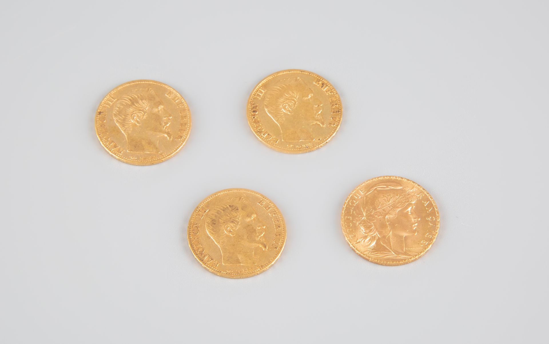 Null 
3枚20法郎的拿破仑三世硬币和一枚20法郎的玛丽安金币。P:25.6g