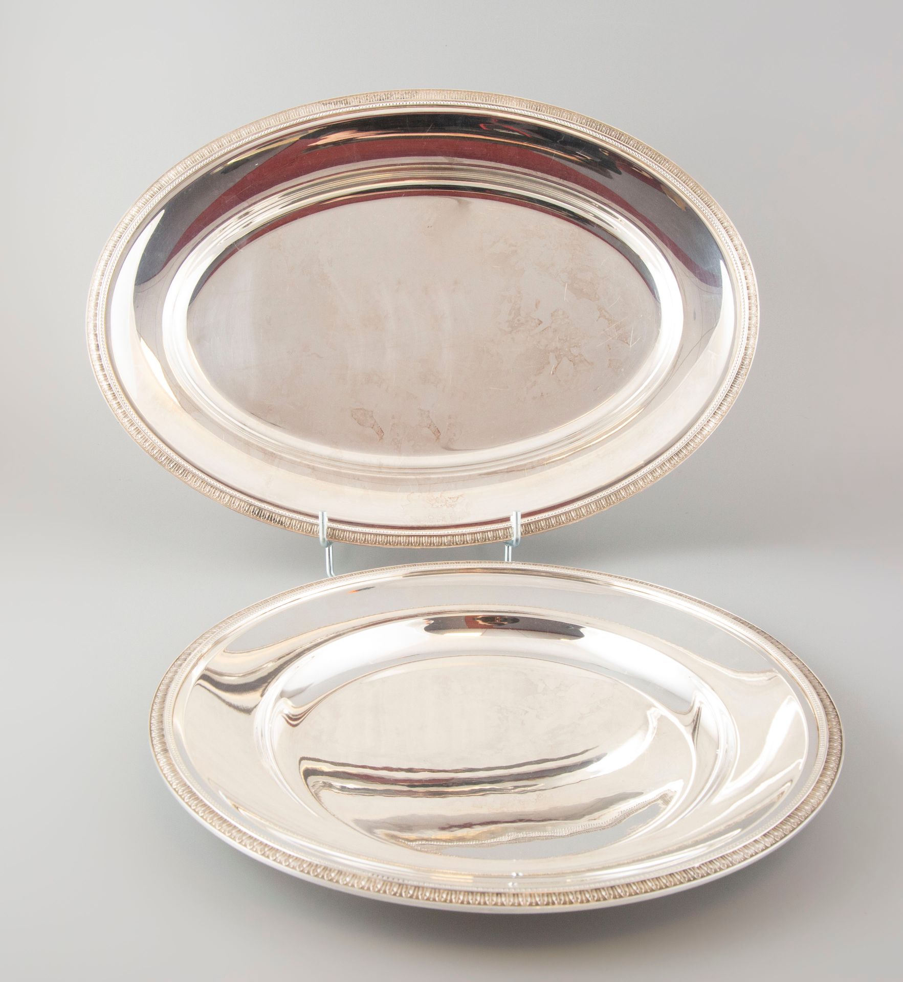 Null CHRISTOFLE France. A hollow dish and an oval dish in silver plated metal de&hellip;