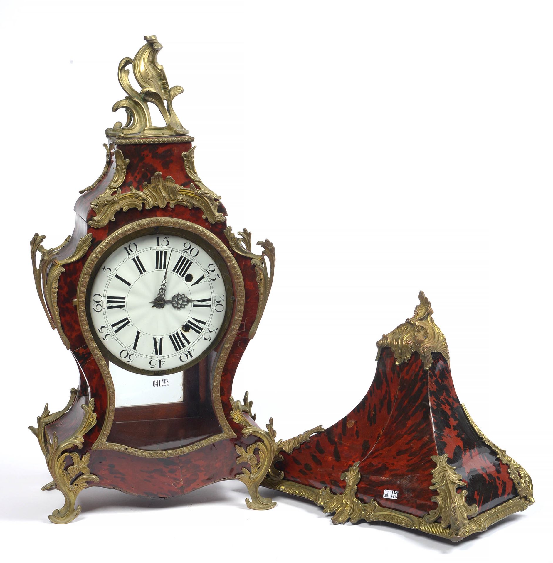 Null 
A Louis XV red tortoiseshell veneer cartel and its console with gilt bronz&hellip;