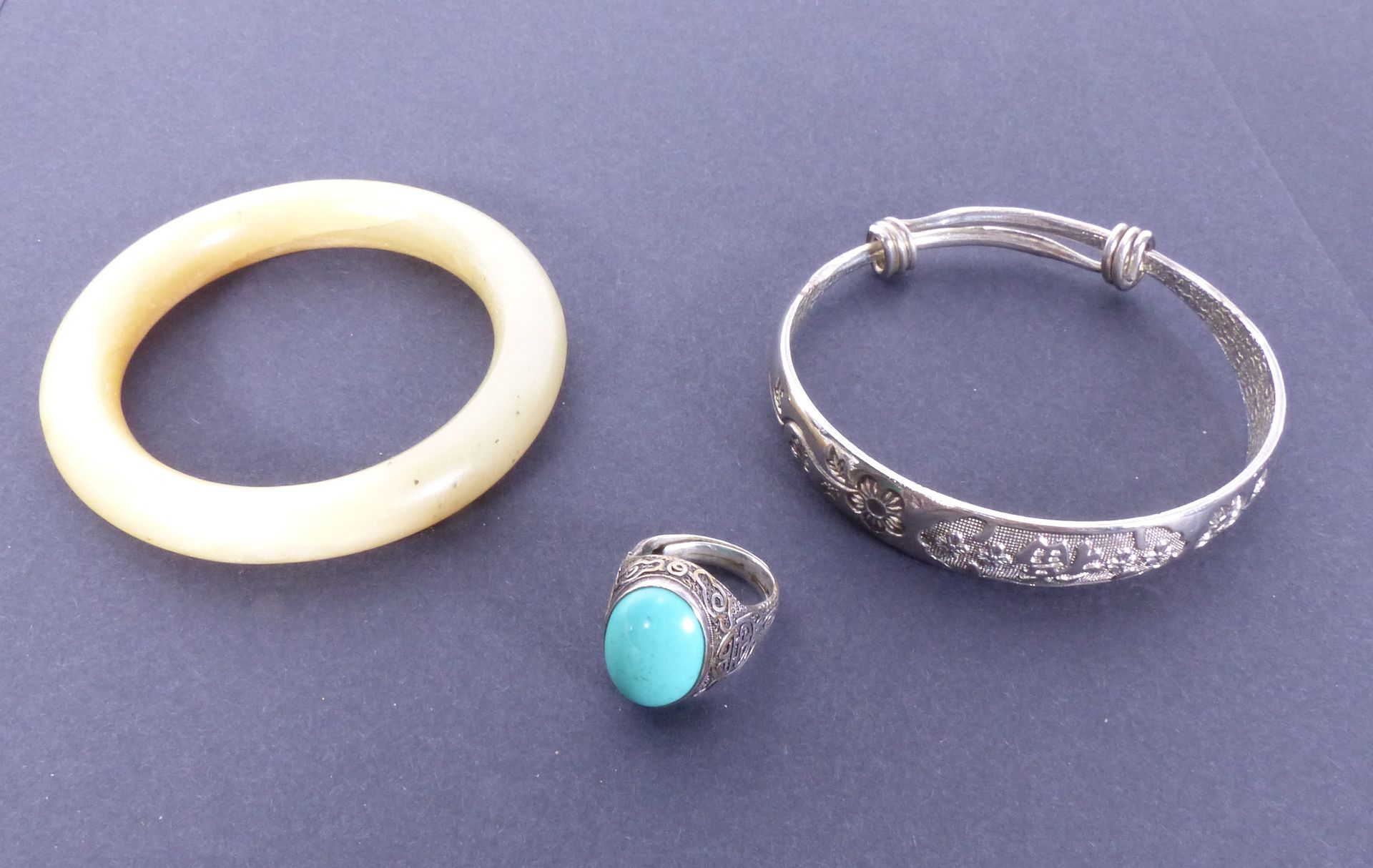 Null A silver bracelet and a silver ring set with turquoise. Finger (Metric): 53&hellip;