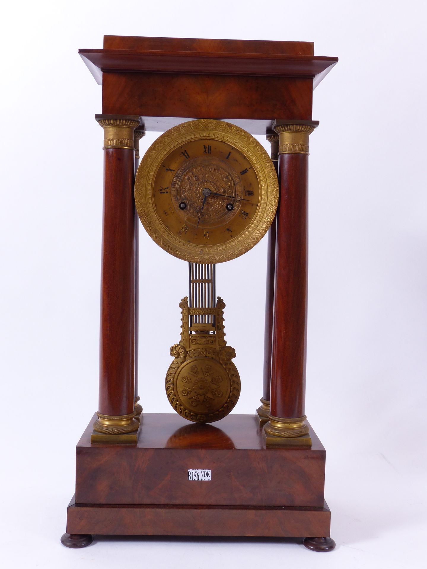 Null A Restoration clock with 4 columns in mahogany and gilt bronze. Period: XIX&hellip;