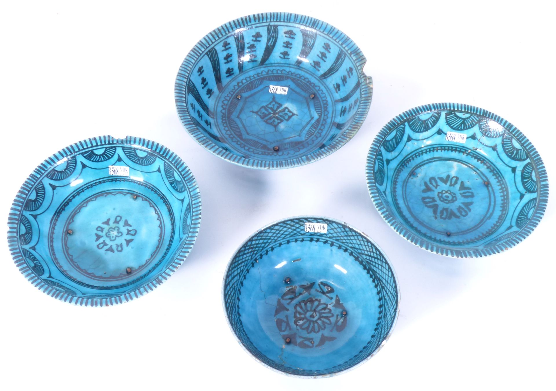 Null Four small round and hollow turquoise ceramic dishes. Ancient Iranian work.&hellip;