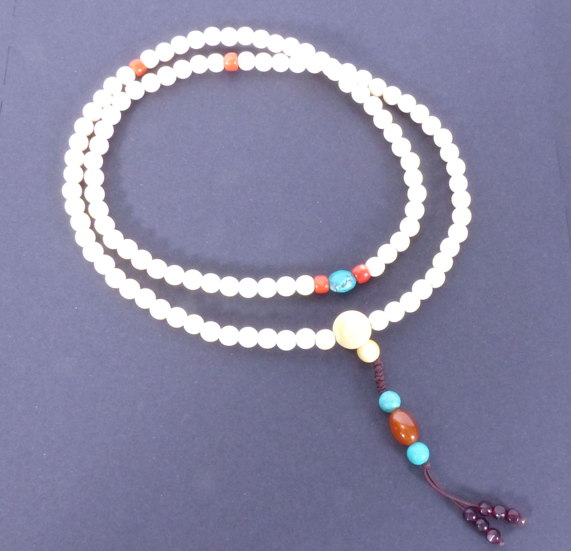 Null Tibetan Mala necklace in ivory, coral, turquoise and amber. L.:+/-93cm.