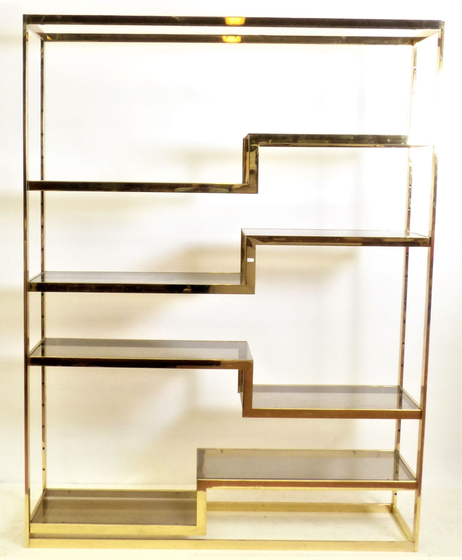 Null Bookcase in gilded metal. Period 1970-80. Dim: 164x40x216 cm.