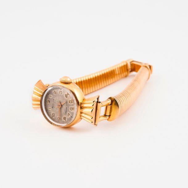 Null Montre bracelet de dame en or jaune (750) 

Boîtier rond à attaches trapézo&hellip;