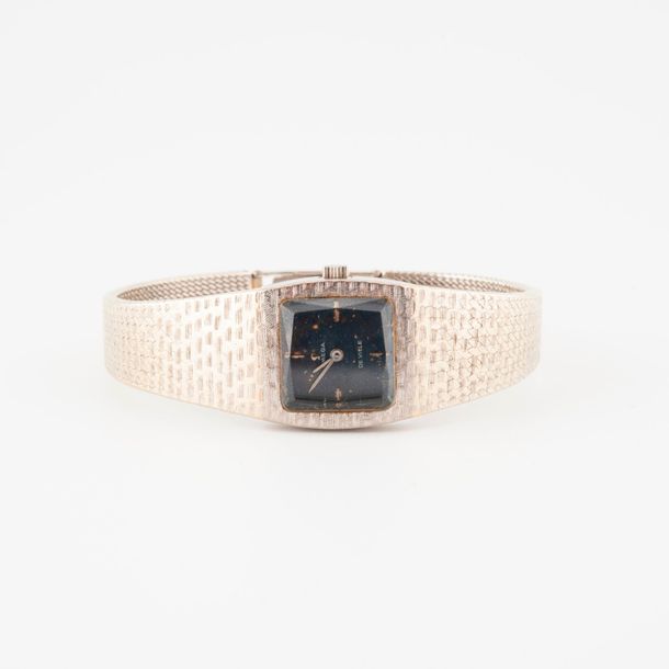 OMEGA DE VILLE 

Montre bracelet de dame en or gris (750) 

Boîtier carré, lunet&hellip;