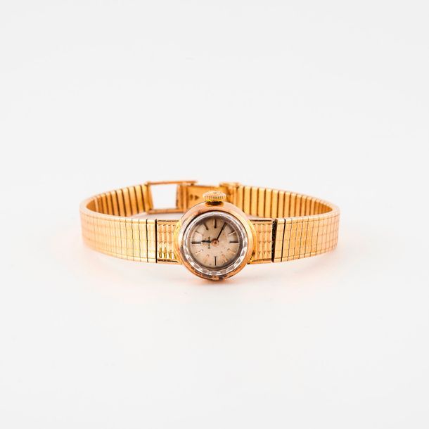 OMEGA 

Montre bracelet de dame en or jaune (750) 

Boîtier rond, lunette cranté&hellip;