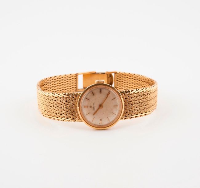 ZENITH 

Lady's bracelet watch in yellow gold (750).

Round case

Cream satin-fi&hellip;