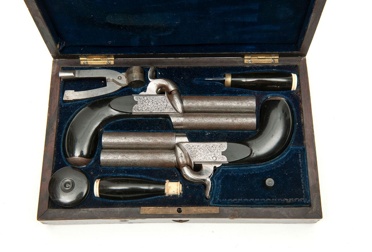 BELGIQUE Pair of two-shot capsule percussion pistols.
With engraved scroll cases&hellip;