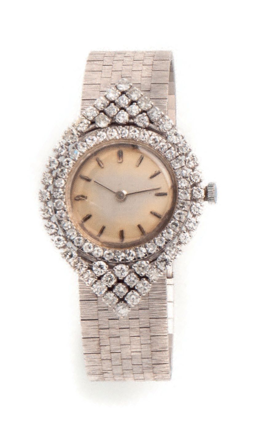 Null Élégante montre bracelet de dame en or gris (750).
Lunette de forme navette&hellip;