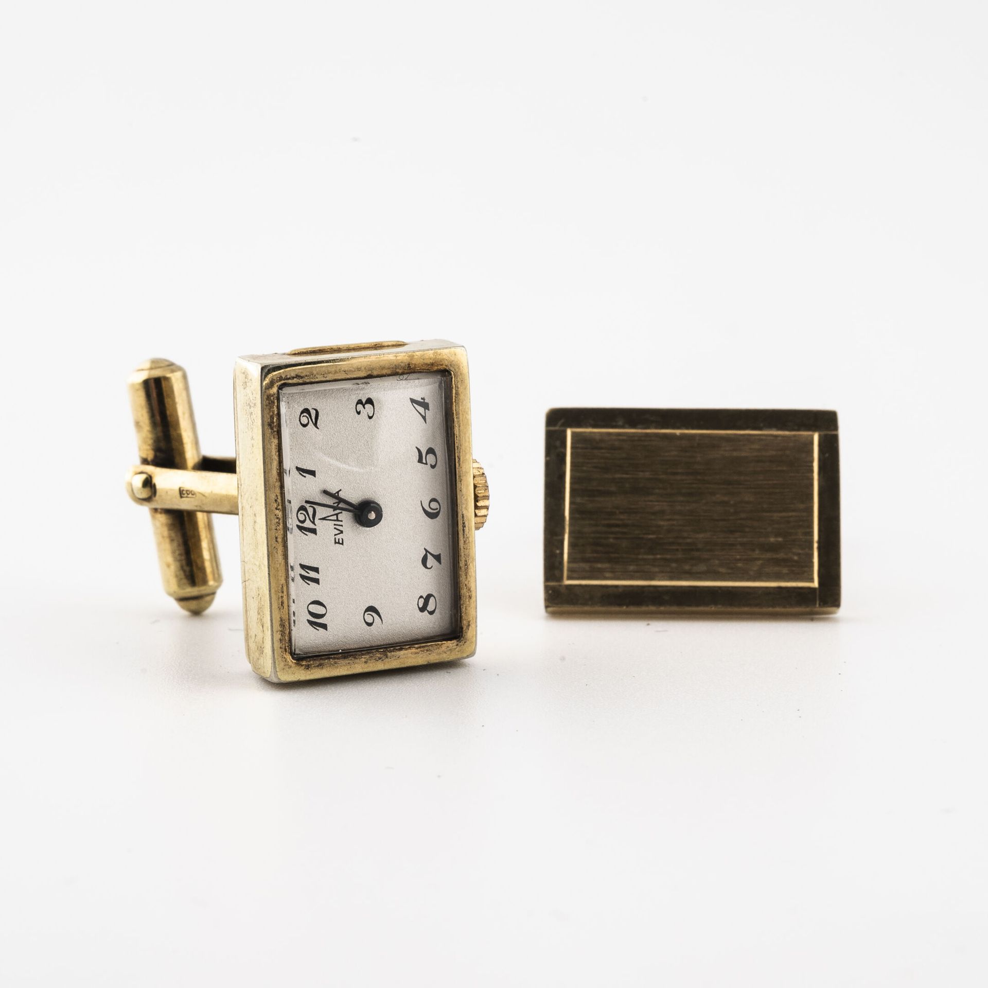 EVIANA Pair of gilt metal cufflinks. 

The rectangular plates, one guilloche, th&hellip;