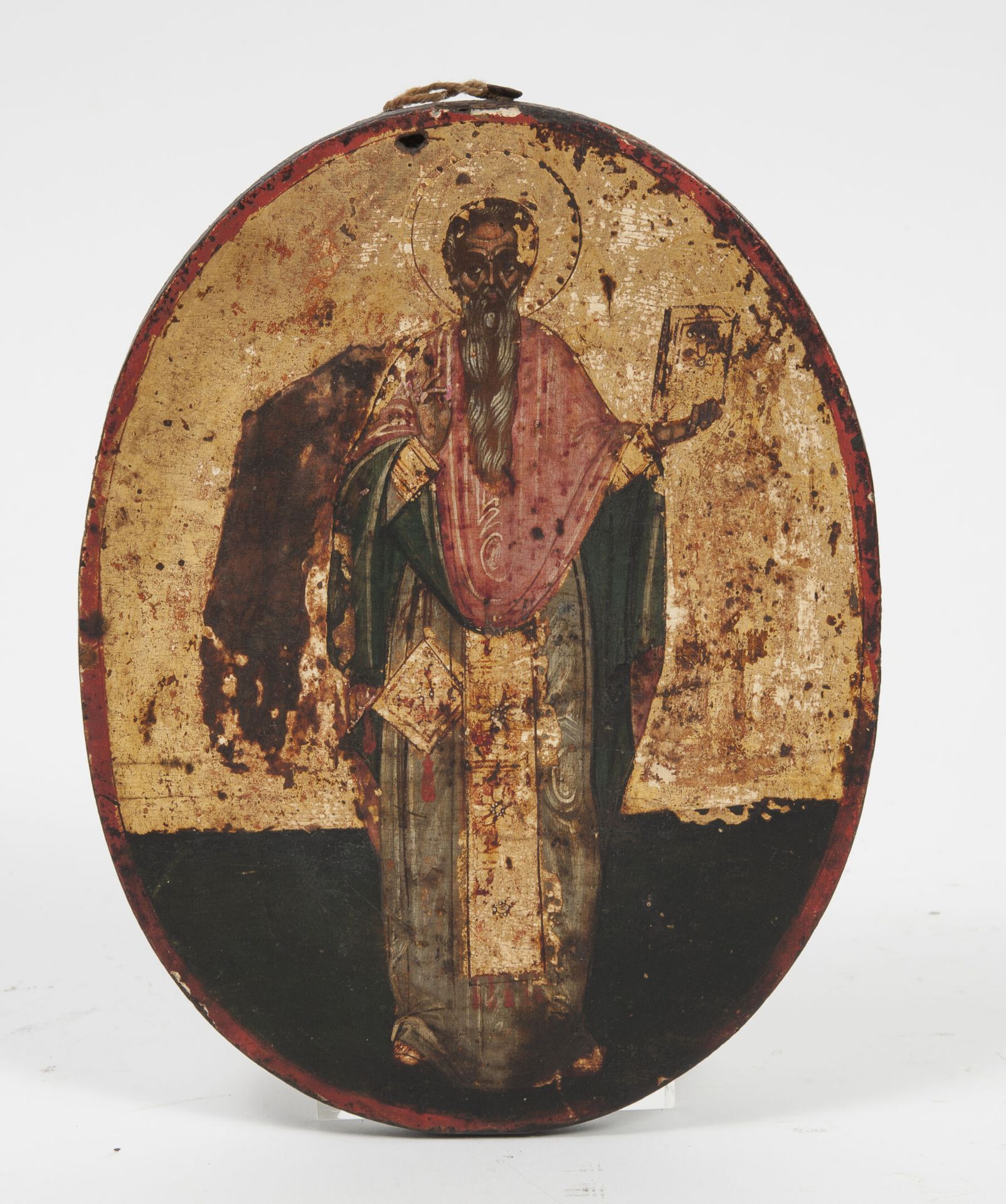 Null 拿着圣经的圣人。

东正教的椭圆形壁炉图标。

在木头上的镀金背景上的淡彩画。

19世纪。

18 x 14,5厘米。

磨损，特别是镀金，顶部穿孔&hellip;