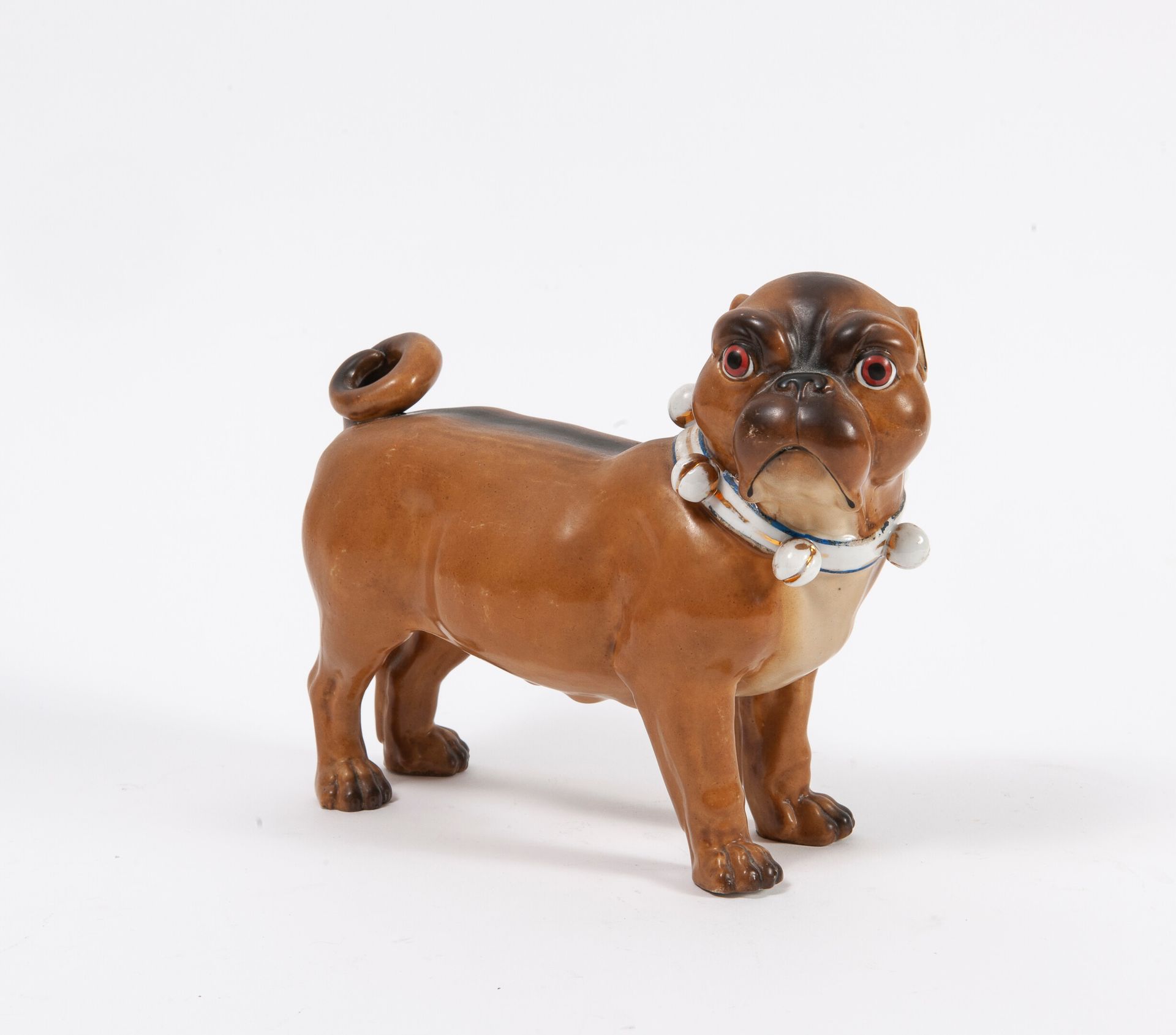 ALLEMAGNE, XXème siècle A natural enameled porcelain standing pug with a knotted&hellip;