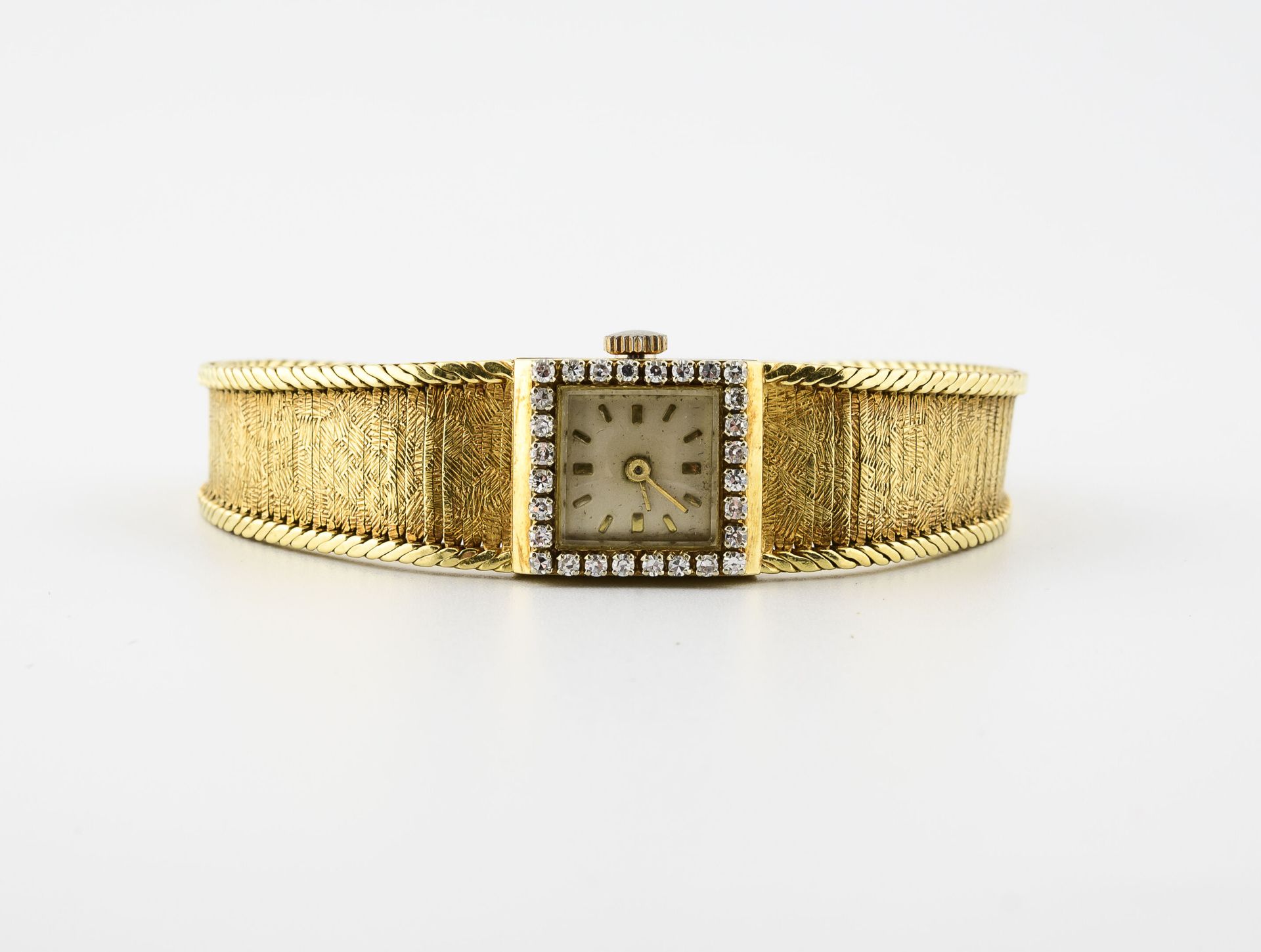 Null Montre bracelet de dame en or jaune (750).

Boîtier carré, lunette ornée de&hellip;