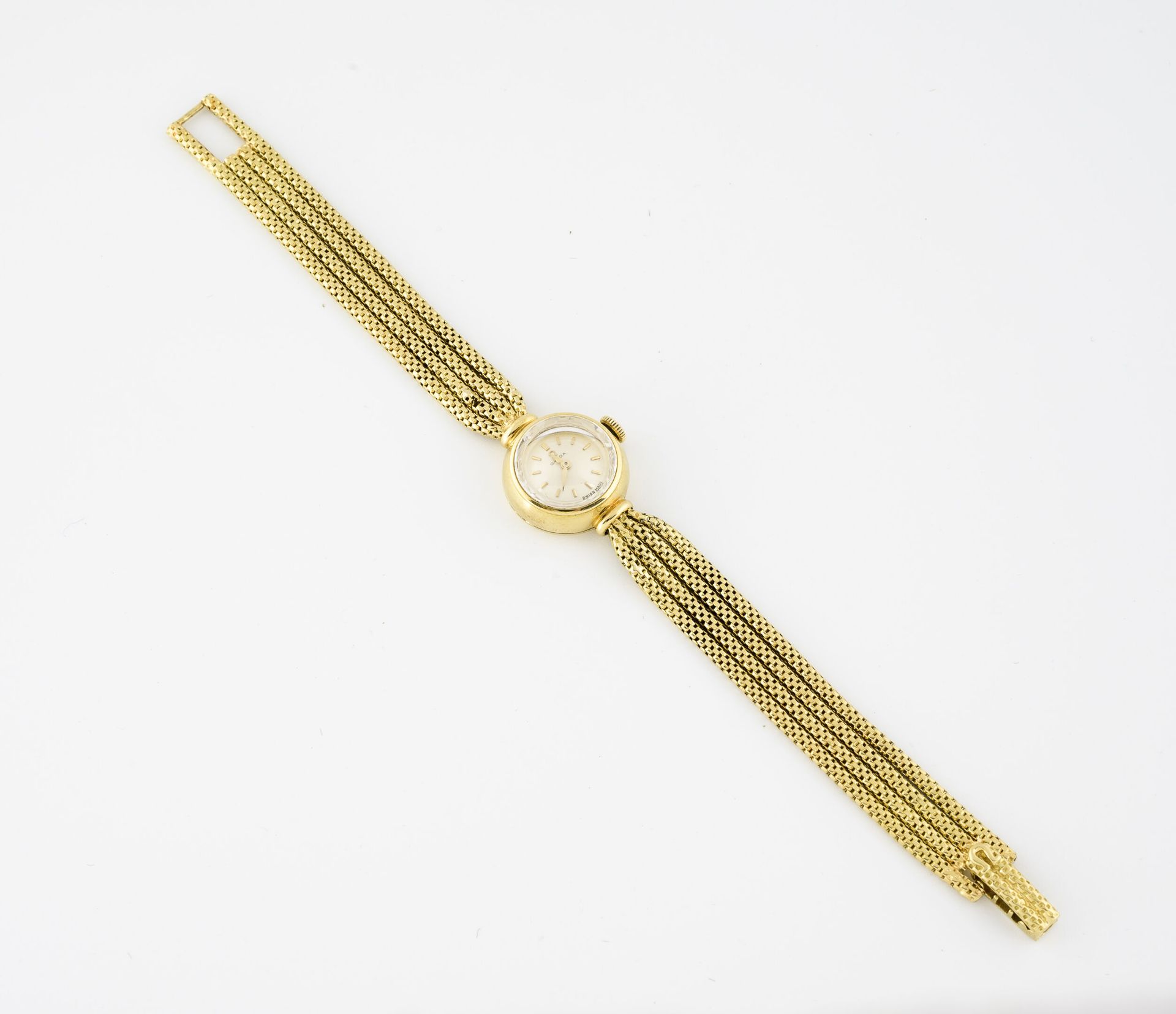 OMEGA Ladies' wristwatch in yellow gold (750).

Round case.

Dial with satin-bru&hellip;