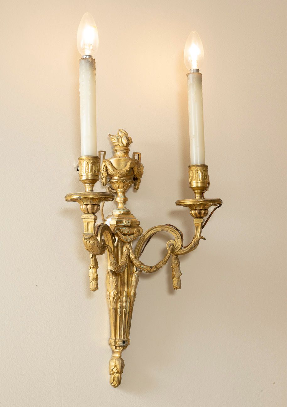 Null Pair of gilt bronze sconces with two lights decorated with garlands and fir&hellip;