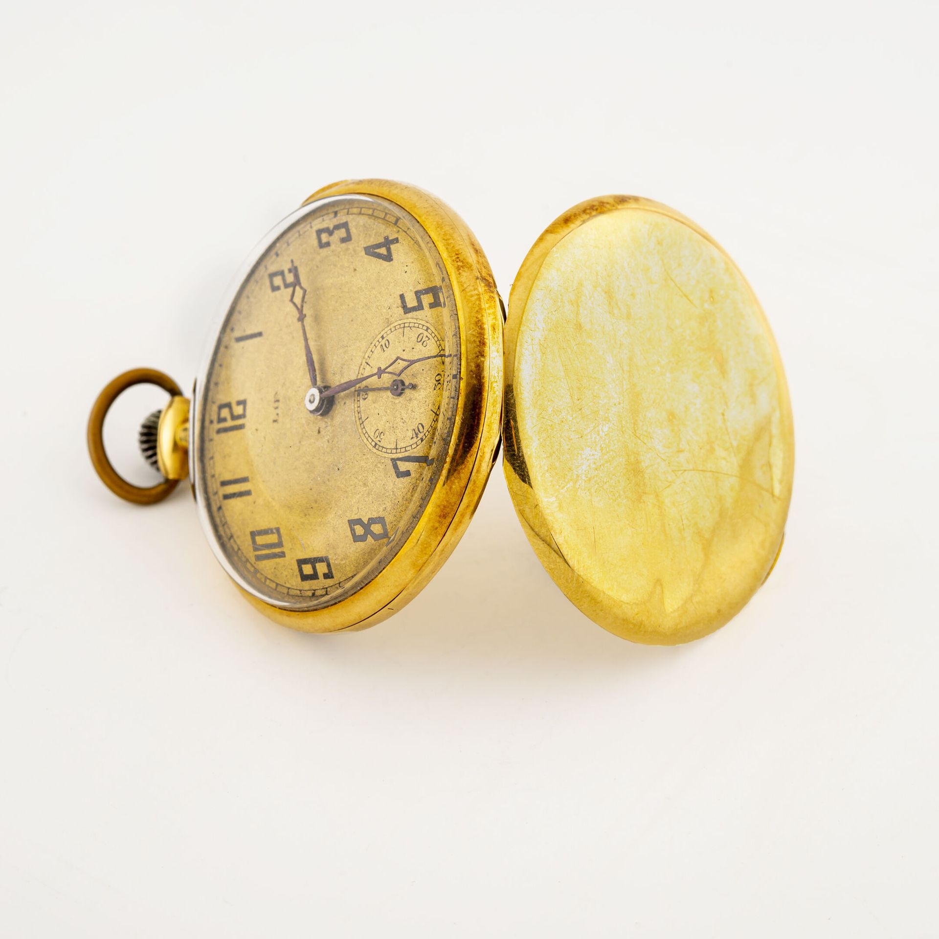 Null Taschenuhr aus Gelbgold (750).

Hinterer Deckel mit einfarbigem Dekor, numm&hellip;