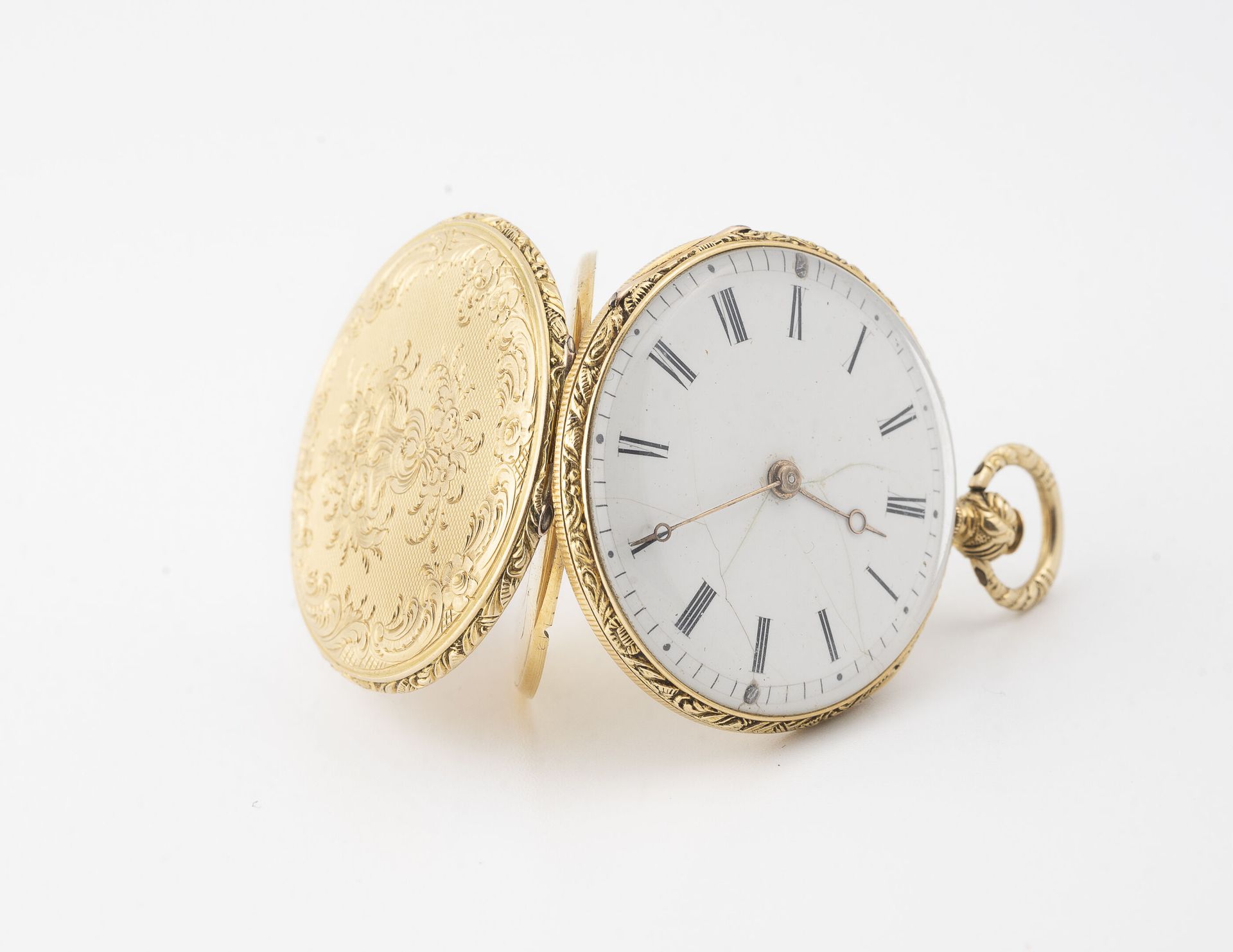 Null Taschenuhr aus Gelbgold (750).

Hinterer Deckel erhält ein Blumendekor und &hellip;