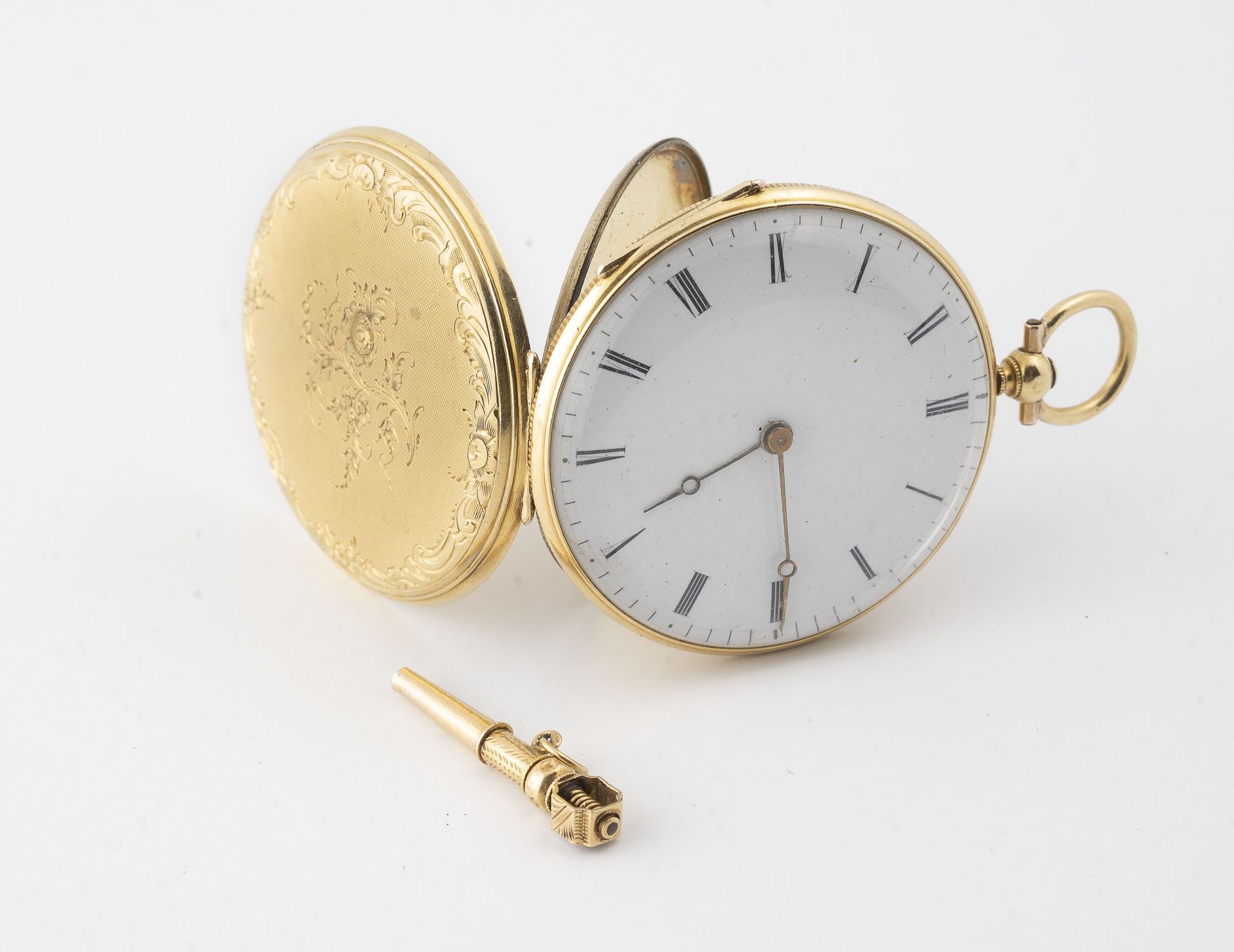 Null Pocket watch in yellow gold (750).

Back cover receiving a floral decoratio&hellip;
