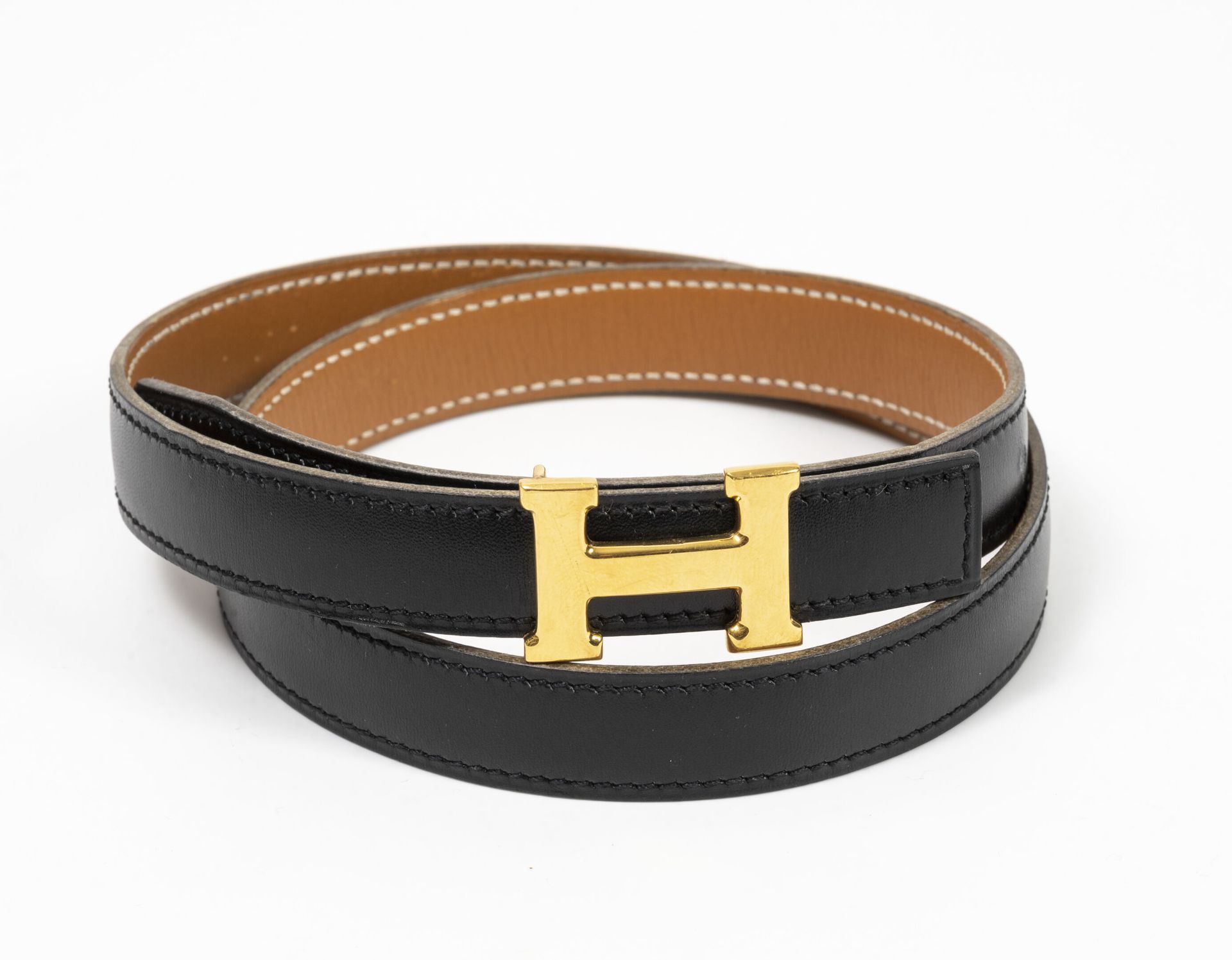 HERMES Paris, H Reversible black and tan leather belt with removable gold metal &hellip;