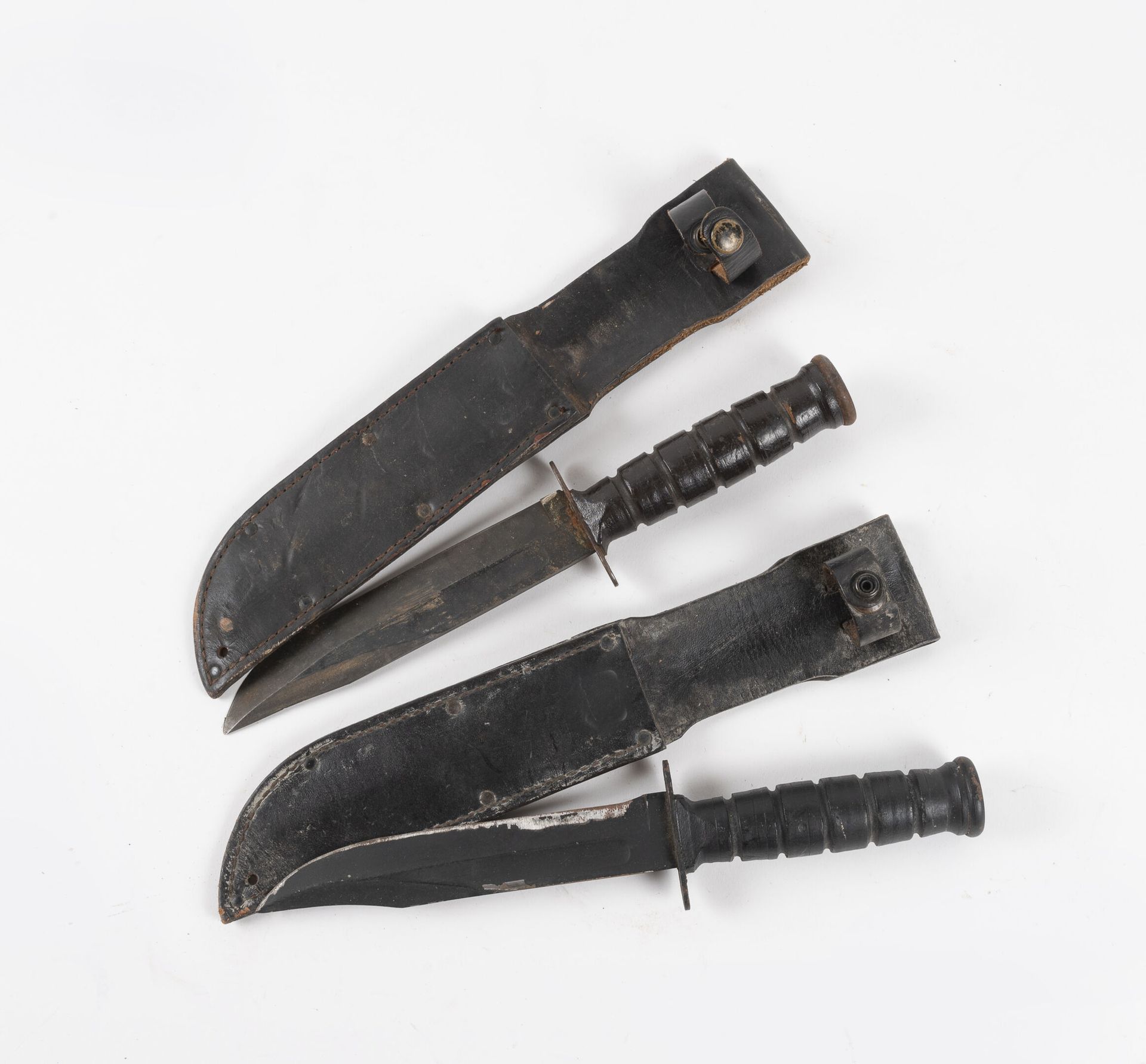 Null Two American Camillus daggers.

Black leather handle. Markings on the heels&hellip;