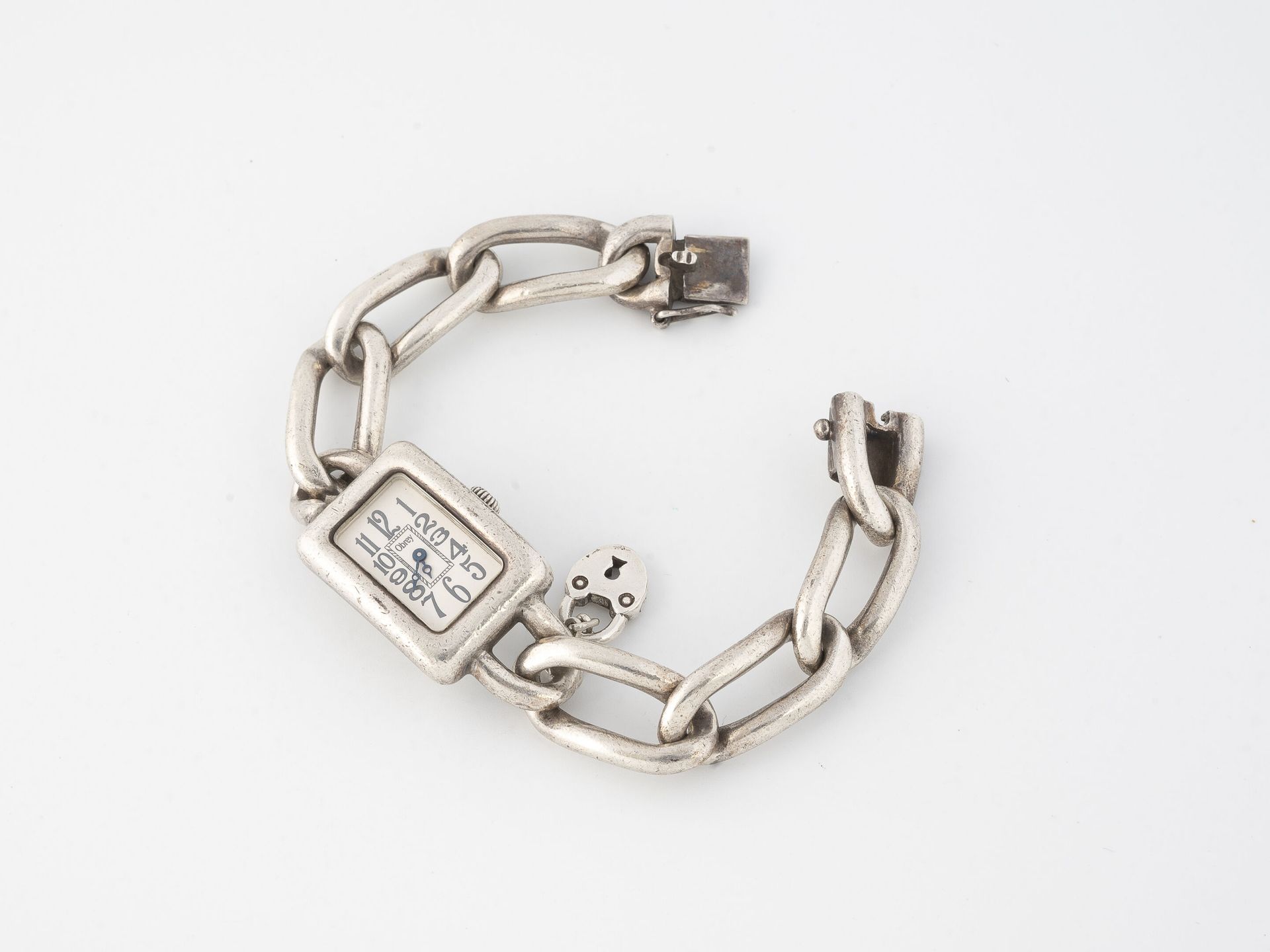 OBREY Montre bracelet de dame en argent (800).

Boîtier rectangulaire. 

Cadran &hellip;