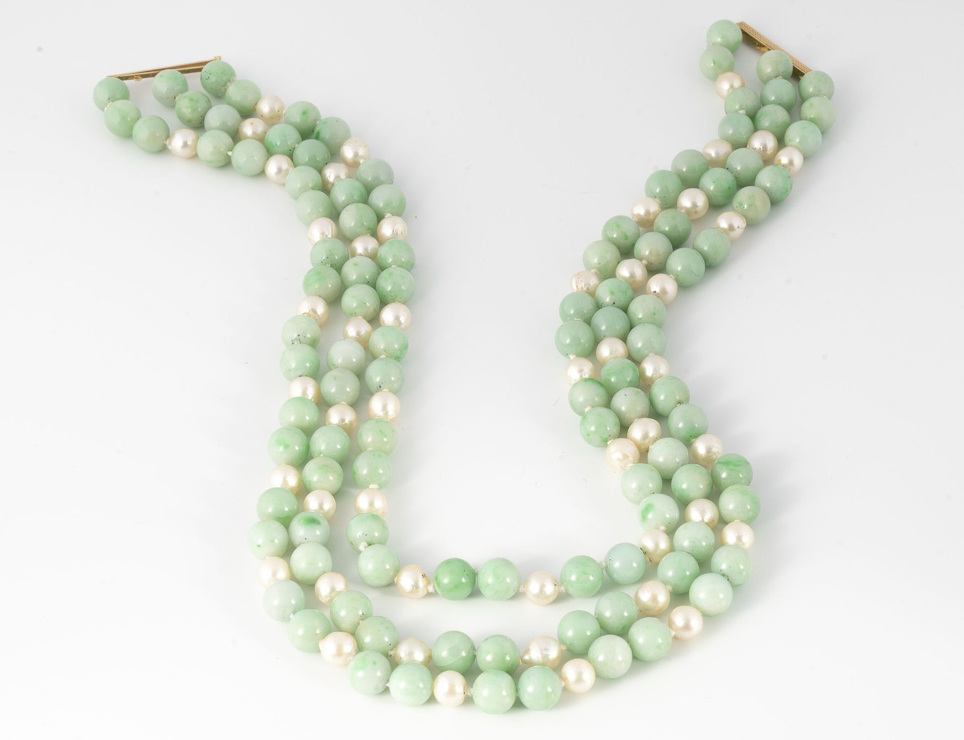 Null Necklace with three rows of jadeite beads alternated with cultured pearls.
&hellip;