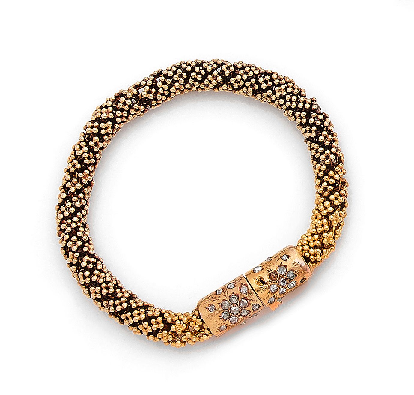 Null Yellow gold (750) bracelet of circular section with millegrain mesh.
Ratche&hellip;