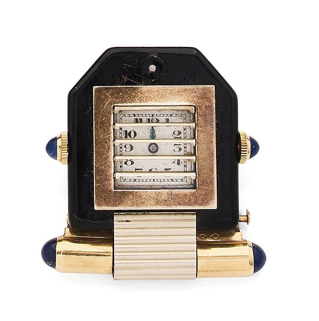 VERGER Frères 胸针表，有75万分之一黄金和黑色珐琅的 "百叶窗"，灵感来自于豪华轿车的散热器，银色的方形表盘上绘有阿拉伯数字，分钟的铁轨。
签署C&hellip;