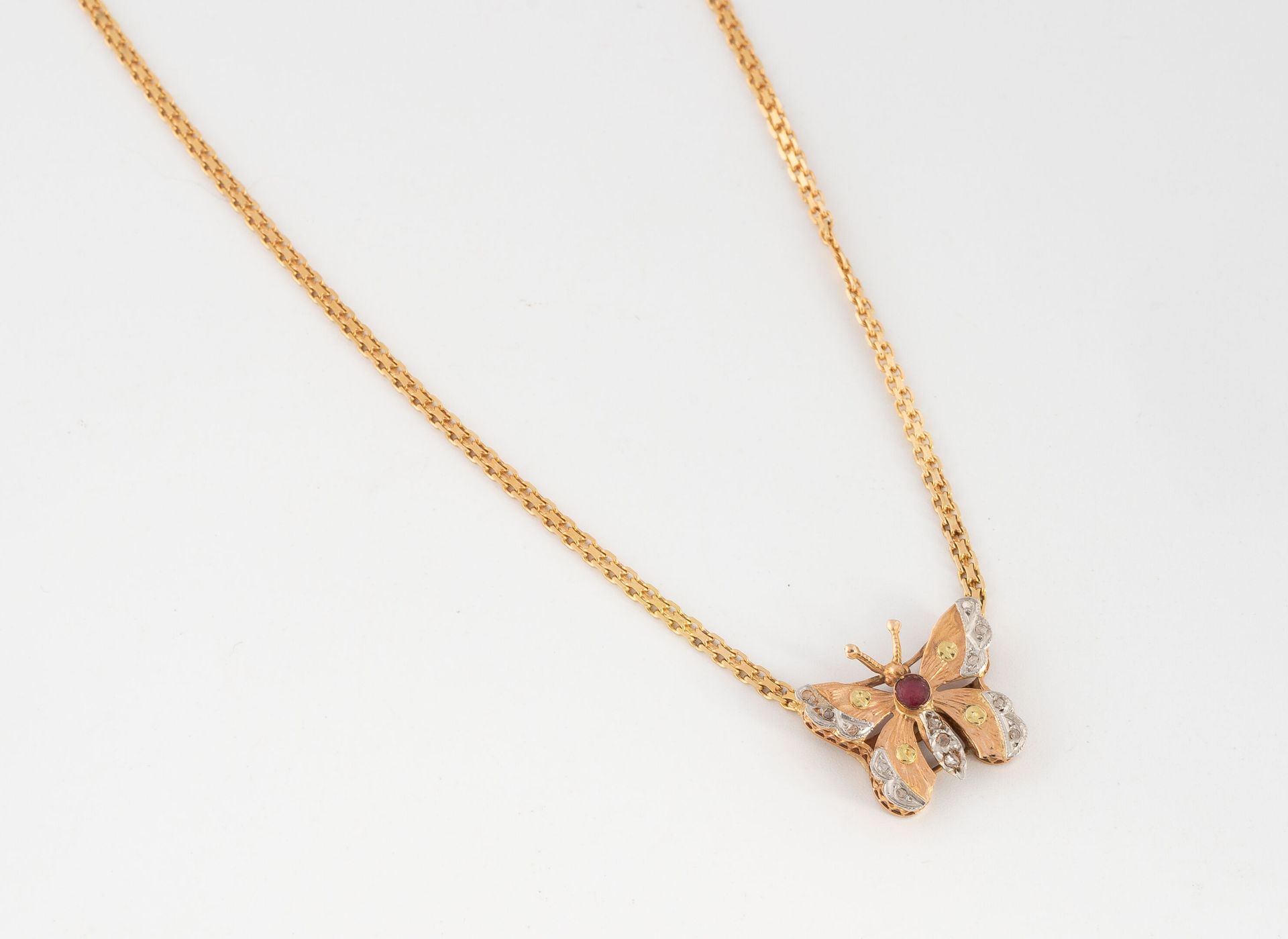 Null Necklace in yellow gold 750 formed of a chain holding a butterfly centered &hellip;