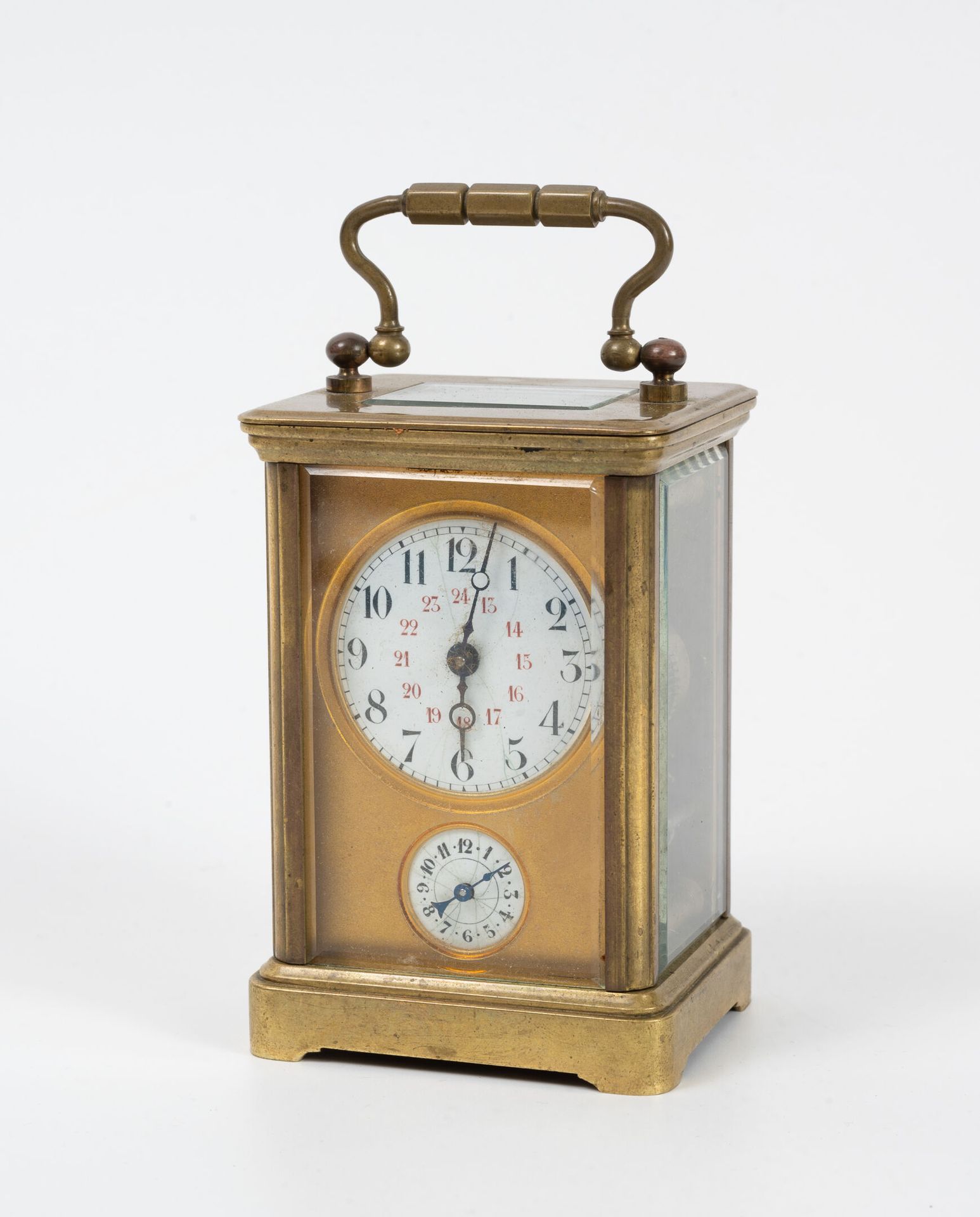 Null Gilded brass officer's clock. 
Rectangular glass cage and beveled, stepped &hellip;